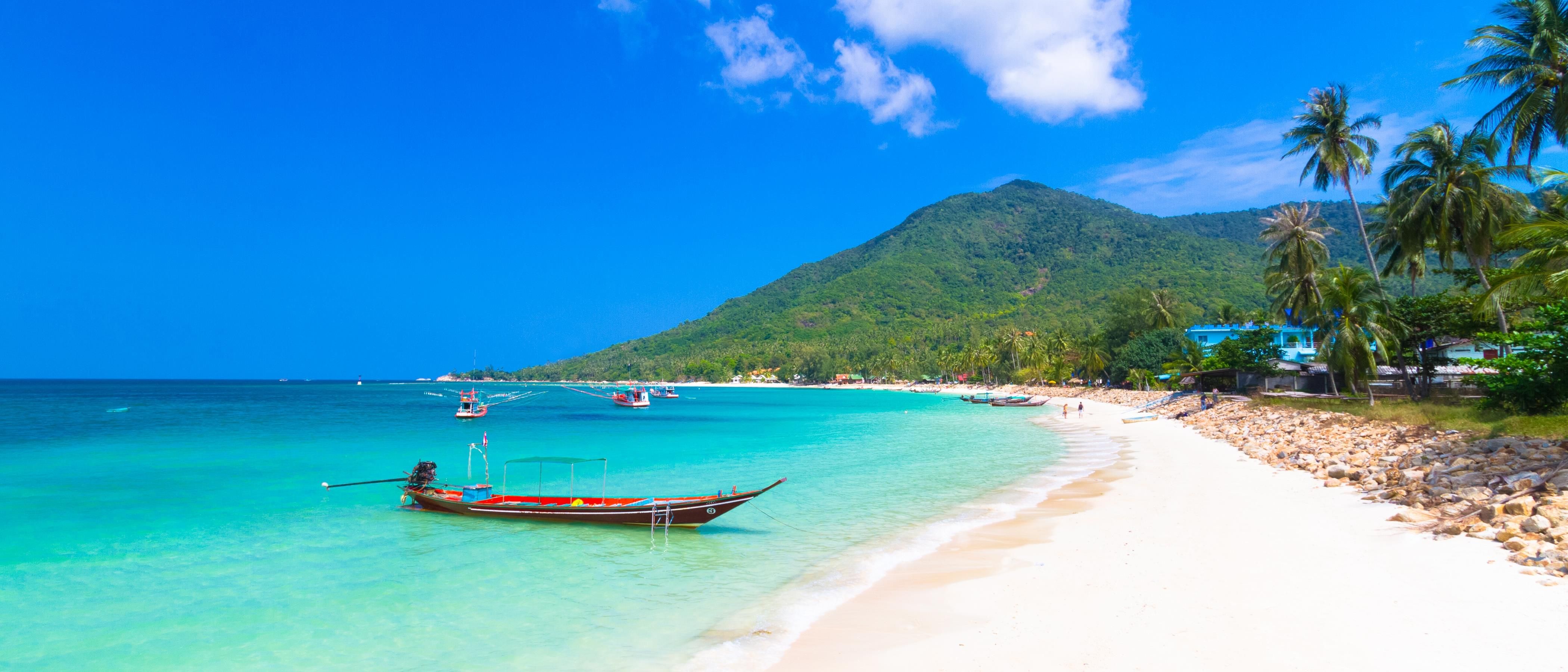 Golden evening light on quiet beach in Koh Pangan, Thailand